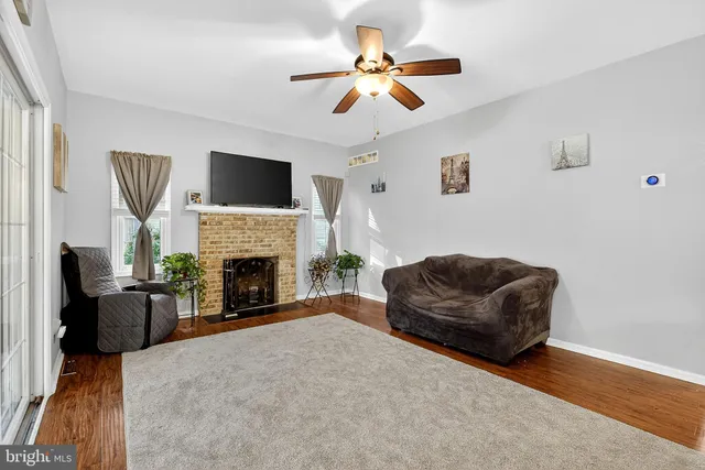a bedroom with a bed and ceiling fan