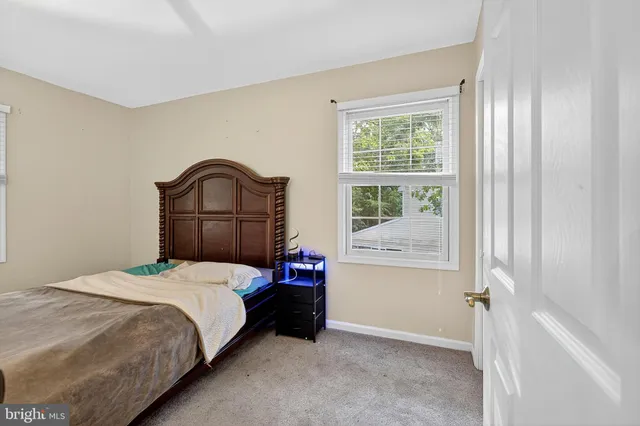 a front view of a house with a yard patio and fire pit