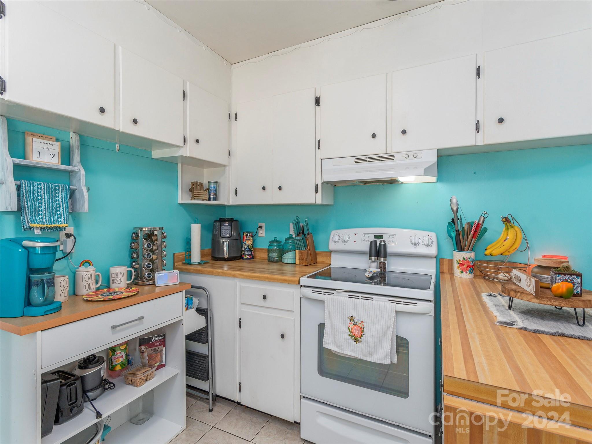 4784 Old Clyde Road Clyde, NC 28721 - Photo 11 of 23 a kitchen with cabinets and appliances