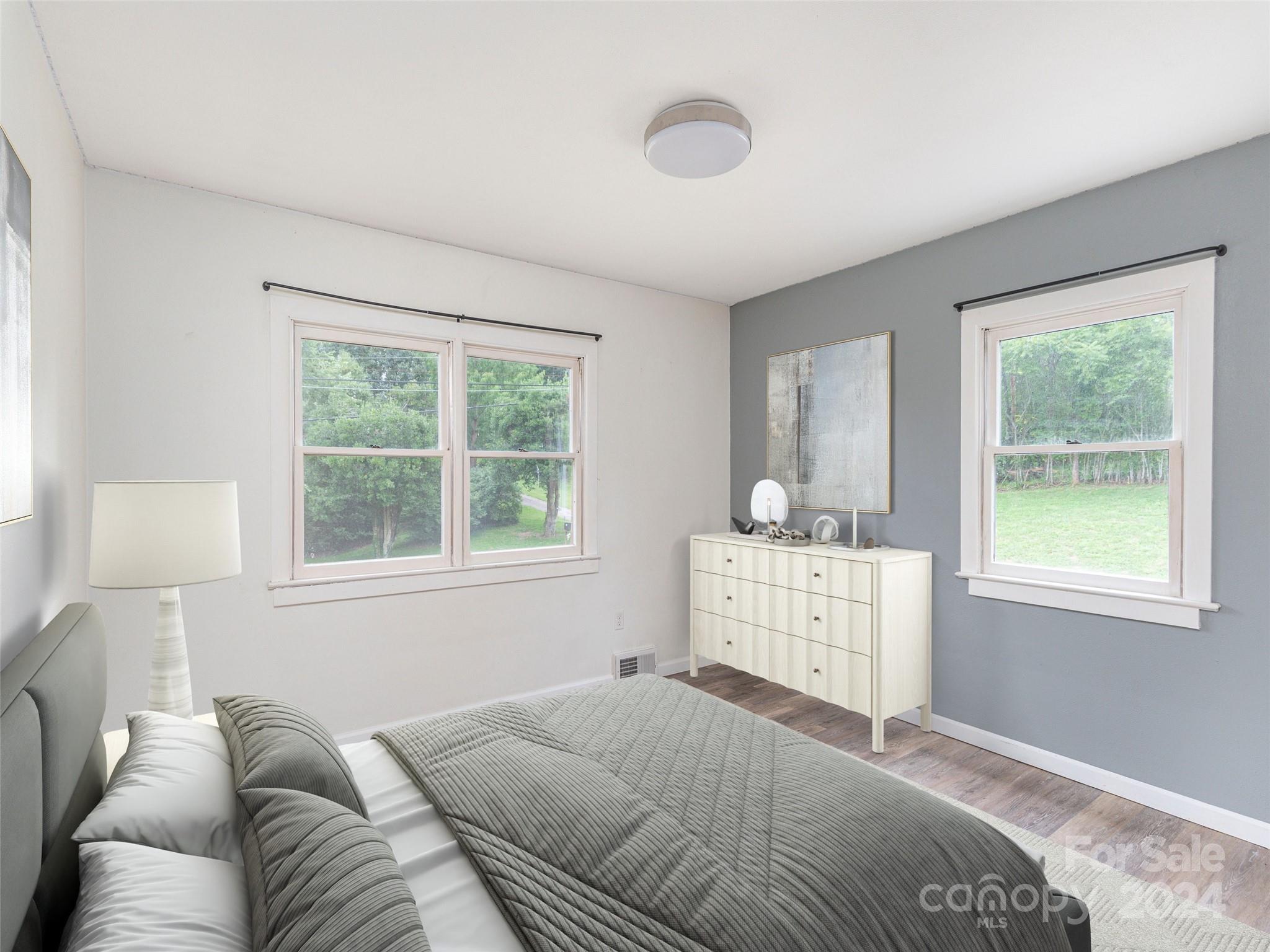 4784 Old Clyde Road Clyde, NC 28721 - Photo 13 of 23 a bed room with a bed and a window