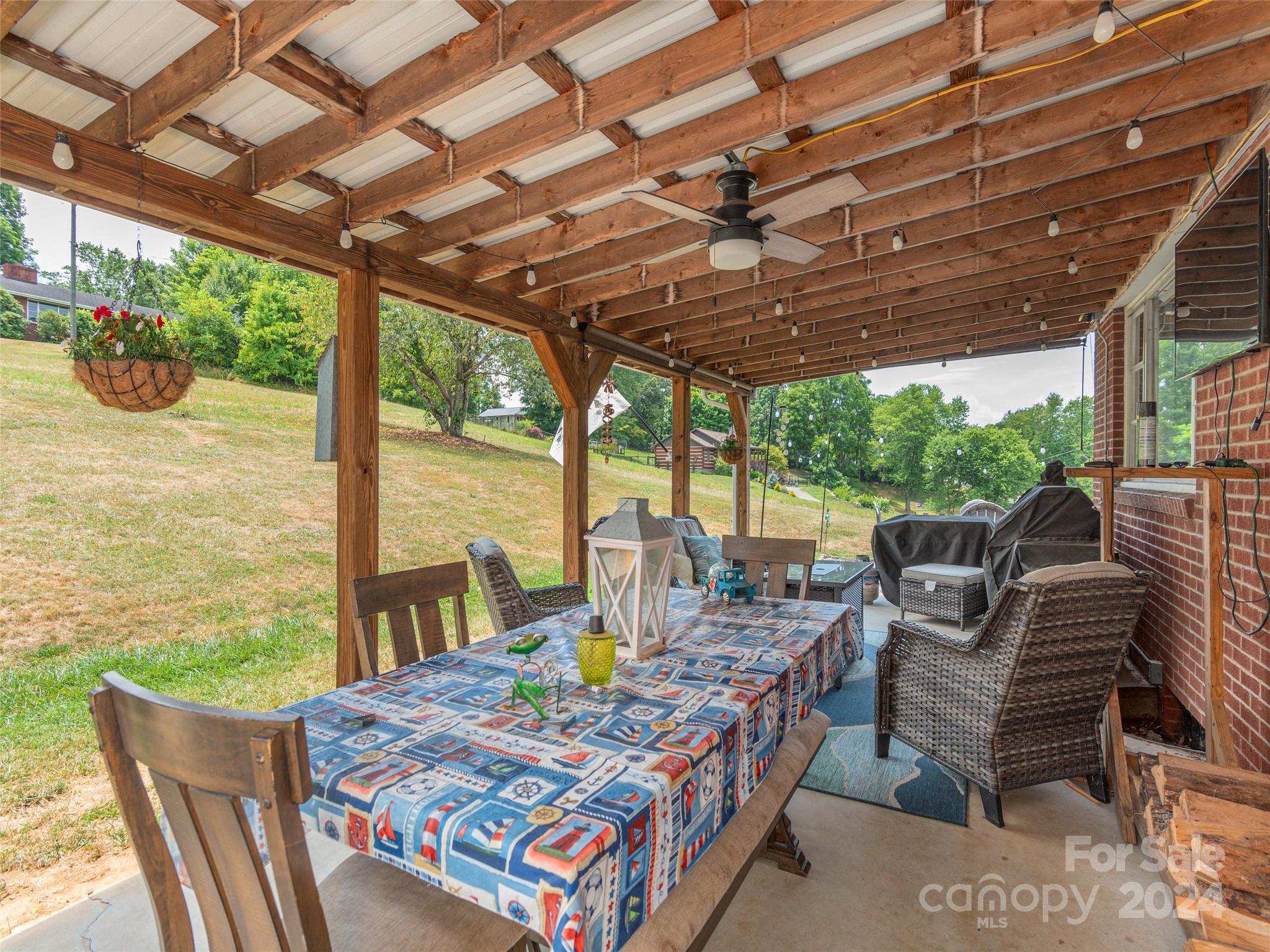 4784 Old Clyde Road Clyde, NC 28721 - Photo 18 of 23 a view of an outdoor dining space with furniture
