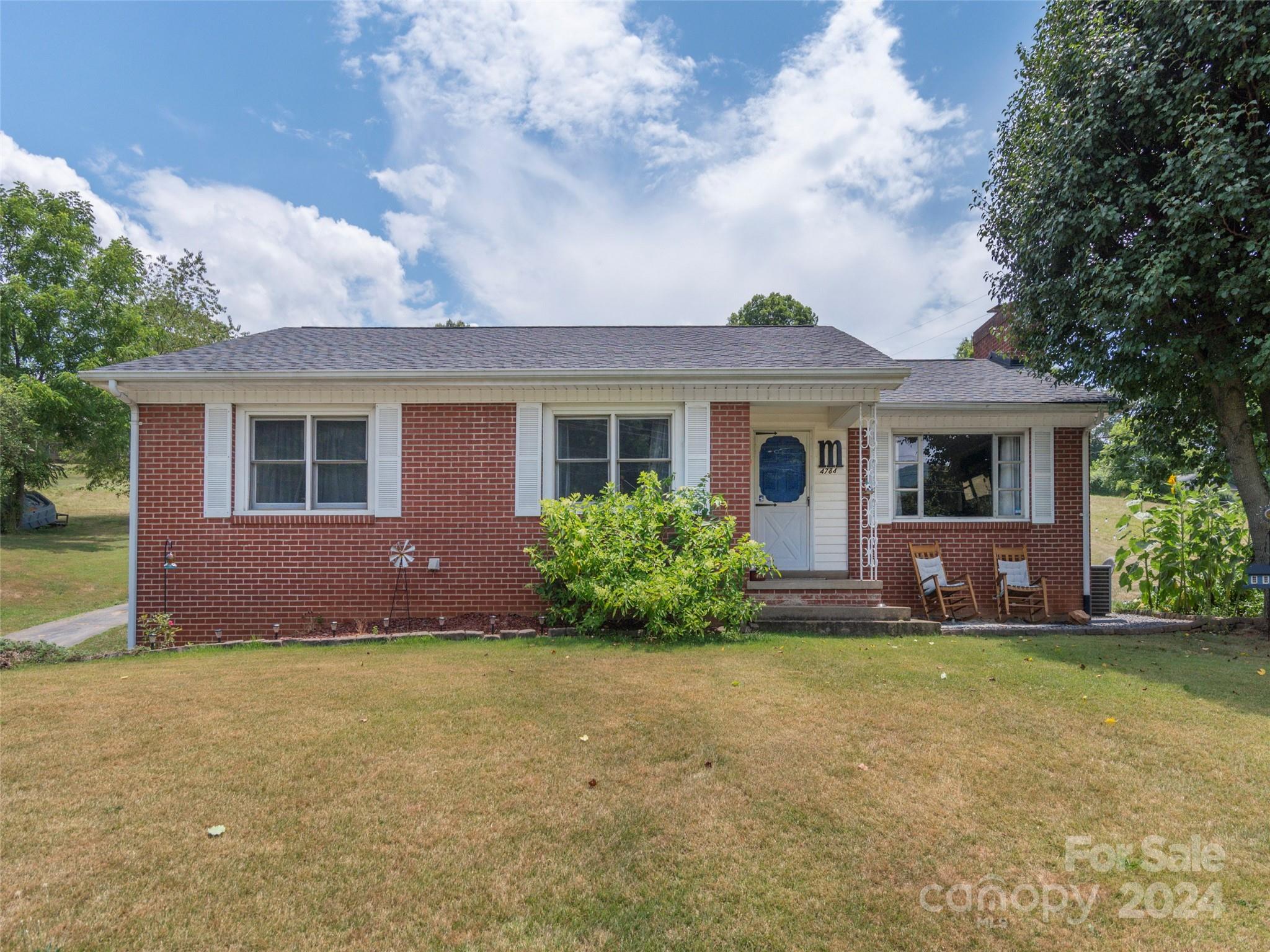 4784 Old Clyde Road Clyde, NC 28721 - Photo 20 of 23 a front view of house with yard and green space