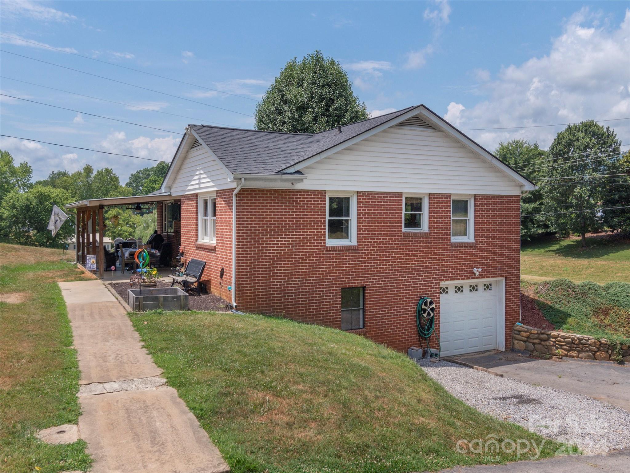 4784 Old Clyde Road Clyde, NC 28721 - Photo 23 of 23 a view of a back yard of the house