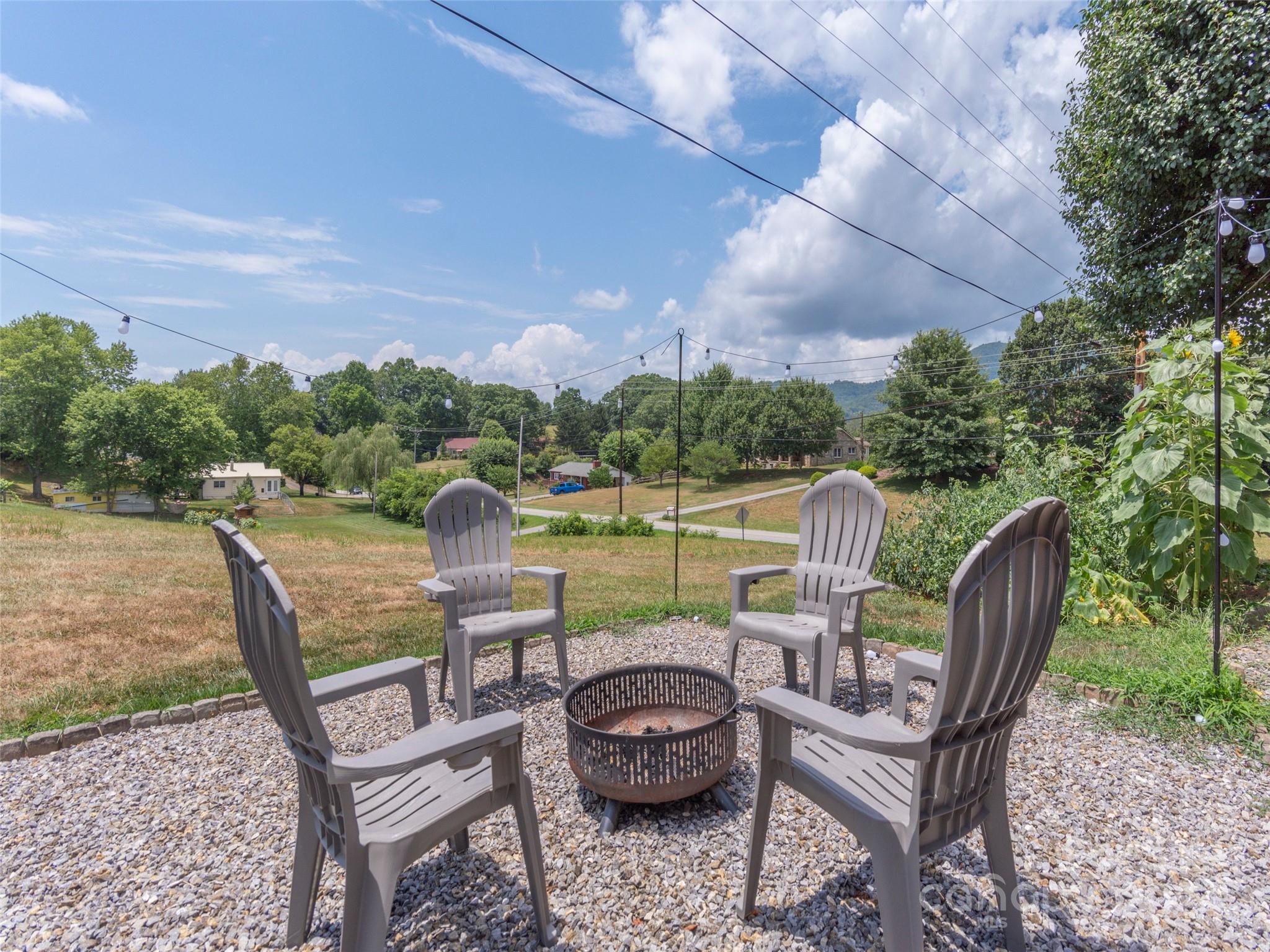 4784 Old Clyde Road Clyde, NC 28721 - Photo 5 of 23 a view of a chairs and table in the patio
