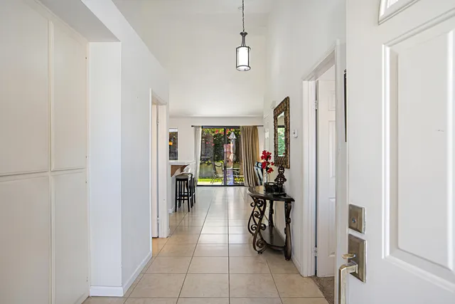 a view of a hallway with living room and furniture