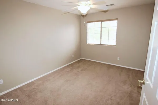 a bathroom with a toilet and shower