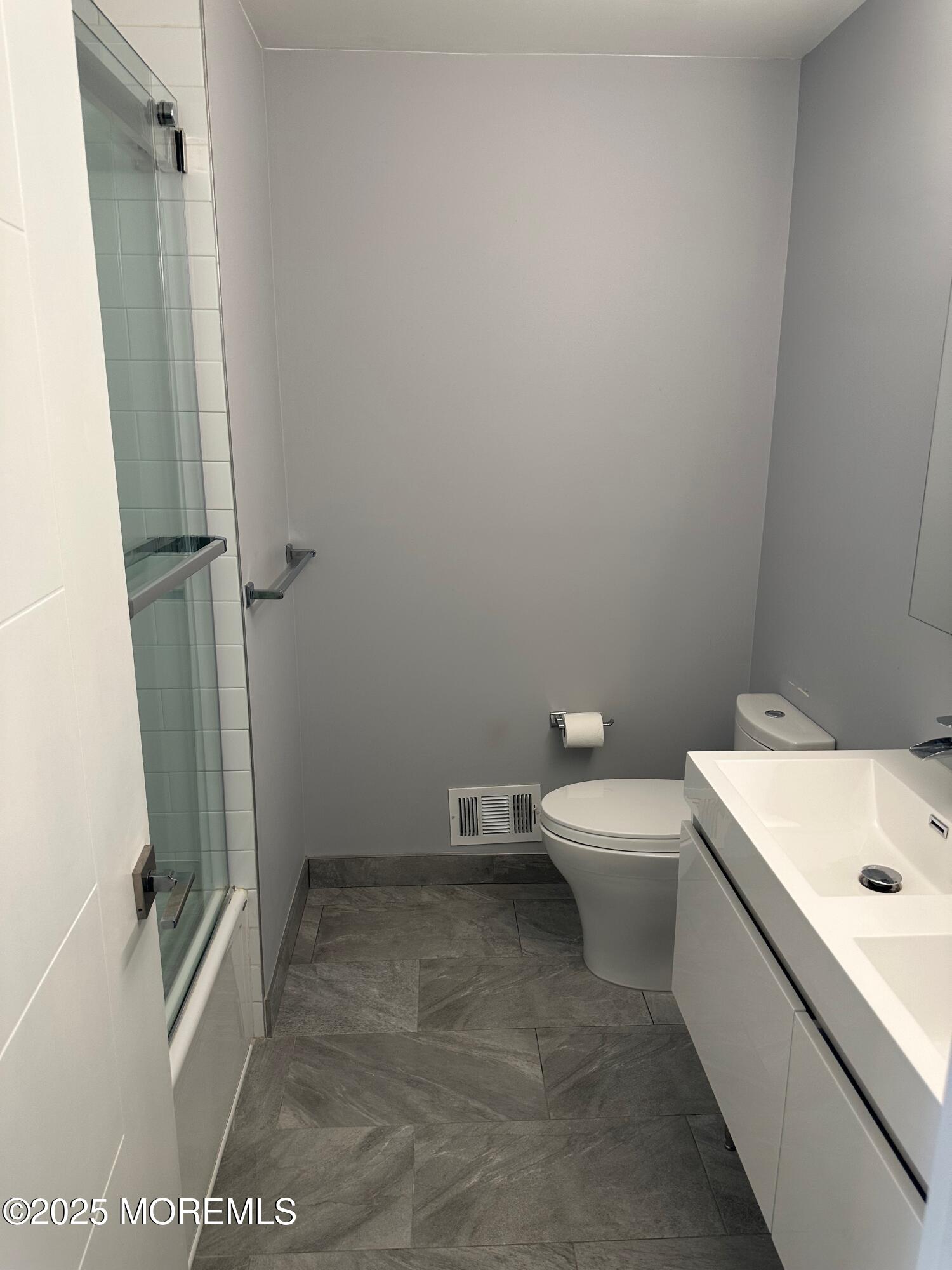 36 Alpine Road, Unit 169 Holmdel, NJ 07733 - Photo 14 of 19 a bathroom with a sink a toilet and shower