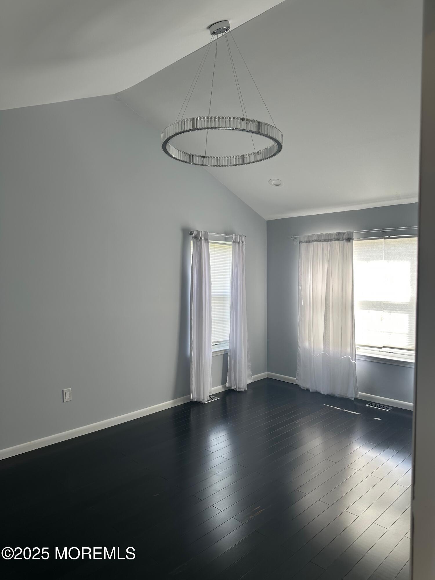 36 Alpine Road, Unit 169 Holmdel, NJ 07733 - Photo 15 of 19 an empty room with wooden floor and windows