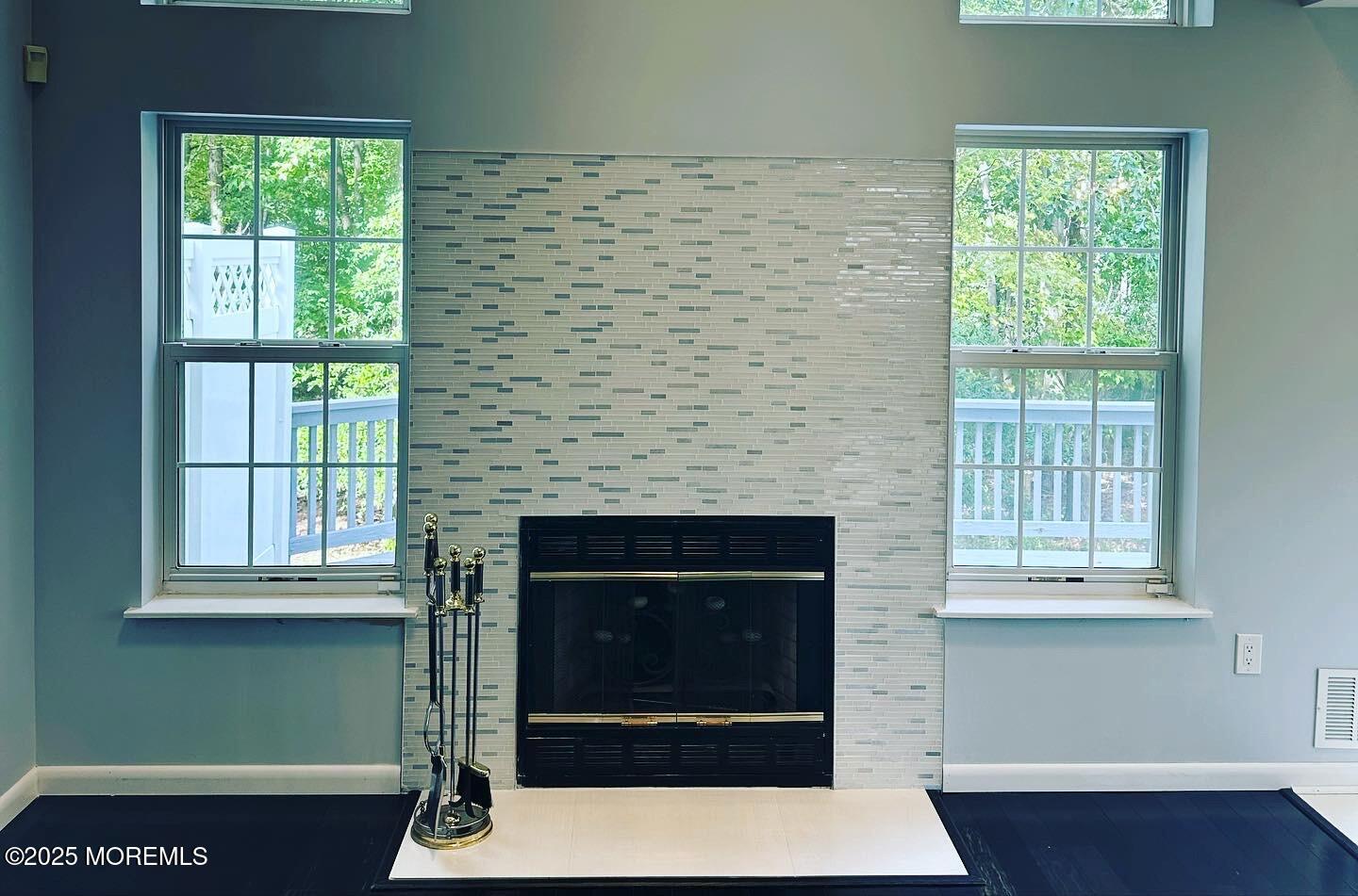 36 Alpine Road, Unit 169 Holmdel, NJ 07733 - Photo 8 of 19 a living room with a fireplace and a window