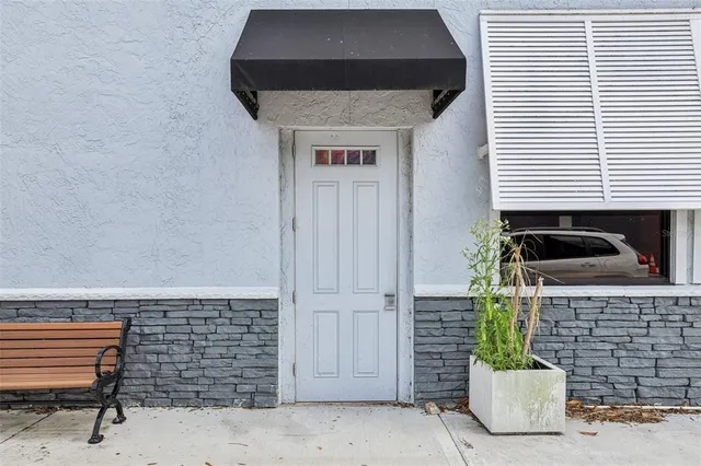 a close view of a sink and a potted plant