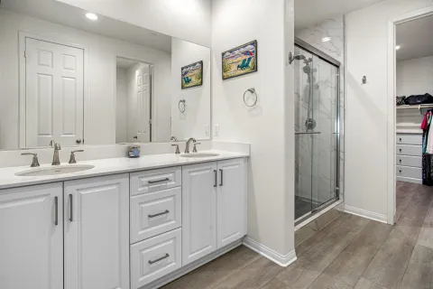 a living room with furniture and a large mirror