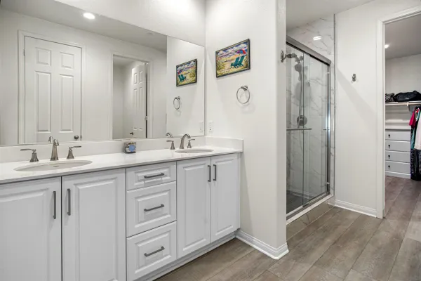 a bathroom with a double vanity sink mirror and double