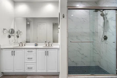 a bedroom with furniture and a flat screen tv