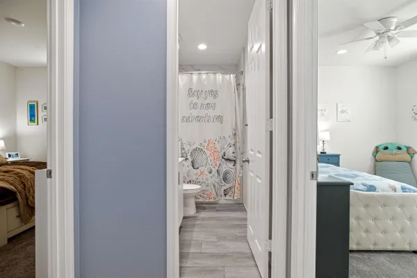 a view of a hallway with living room