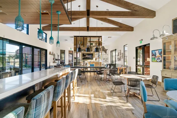 a view of a dining room with lots of tables and chairs