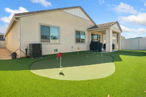 a view of a chairs and table in patio