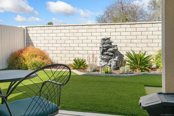 a view of a chairs and table in patio