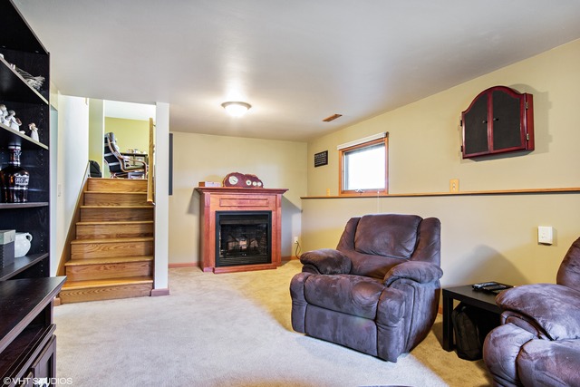 2541 Little Rock Road Plano, IL 60545 - Photo 5 of 13 a living room with furniture and a fireplace