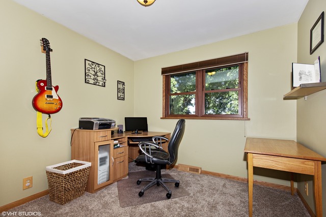 2541 Little Rock Road Plano, IL 60545 - Photo 8 of 13 a view of a workspace with furniture and a window