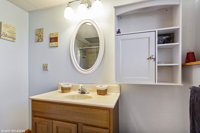 2541 Little Rock Road Plano, IL 60545 - Photo 9 of 13 a bathroom with a sink and a mirror