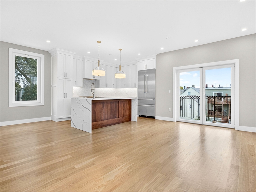 551 East 7th Street, Unit 3 Boston, MA 02127 - Photo 1 of 15 a view of an empty room with kitchen and window