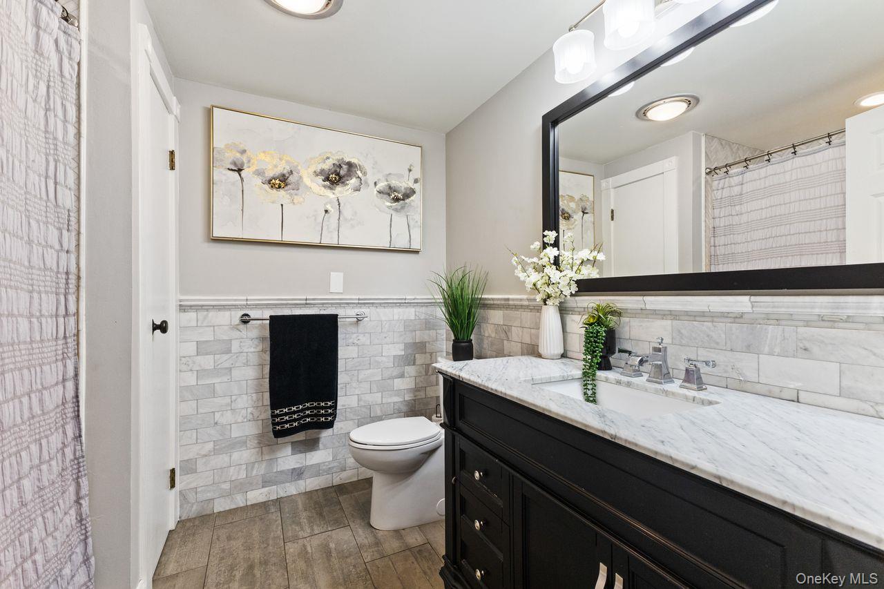 4 Stonewall Farm Road Mahopac, NY 10541 - Photo 21 of 37 Updated hall bathroom with natural stone tile.