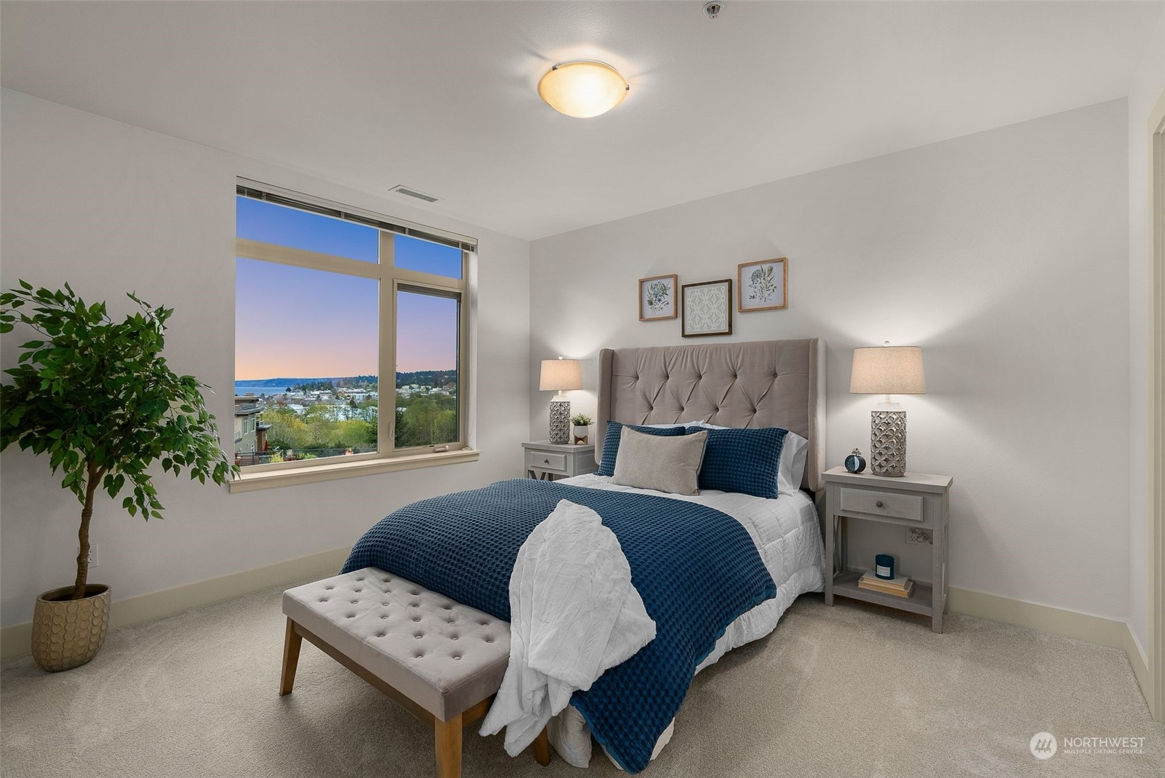 75 Pine Street, Unit 204 Edmonds, WA 98020 - Photo 8 of 30 a bedroom with a bed and a potted plant