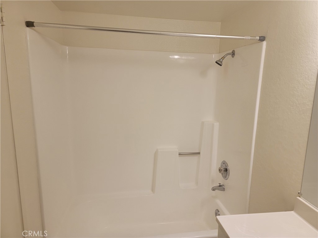 435 West 9th, Unit A7 Upland, CA 91786 - Photo 11 of 13 a bathroom with a shower and a toilet