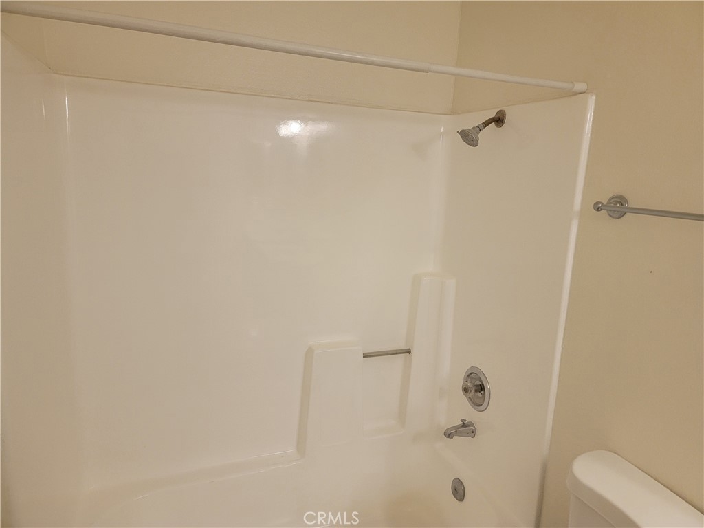 435 West 9th, Unit A7 Upland, CA 91786 - Photo 6 of 13 a bathroom with a shower and a toilet