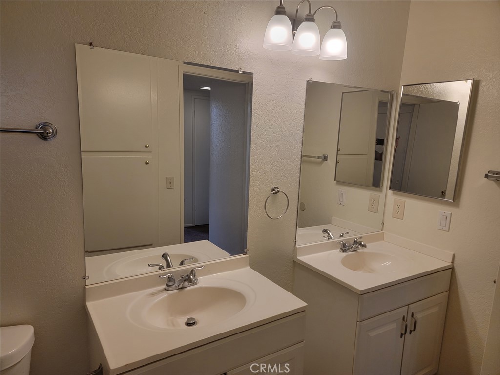 435 West 9th, Unit A7 Upland, CA 91786 - Photo 8 of 13 a bathroom with a sink and a mirror