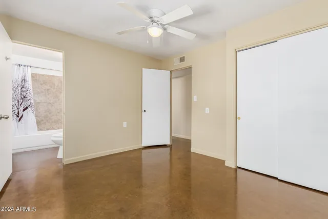 a view of an empty room with a window