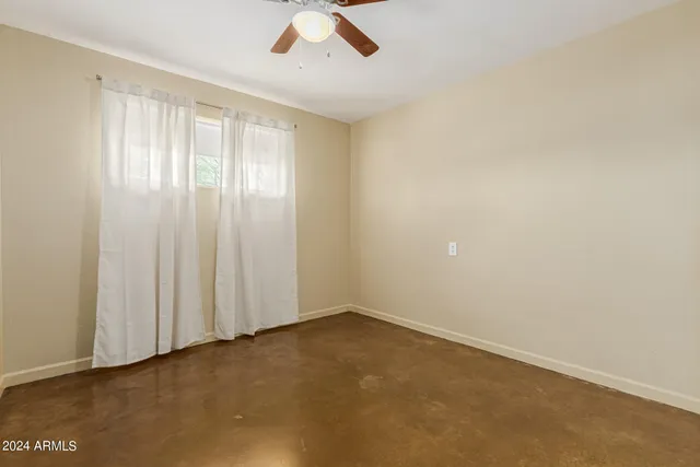 an empty room with a empty space and a window