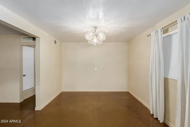 a view of a chandelier in an empty room