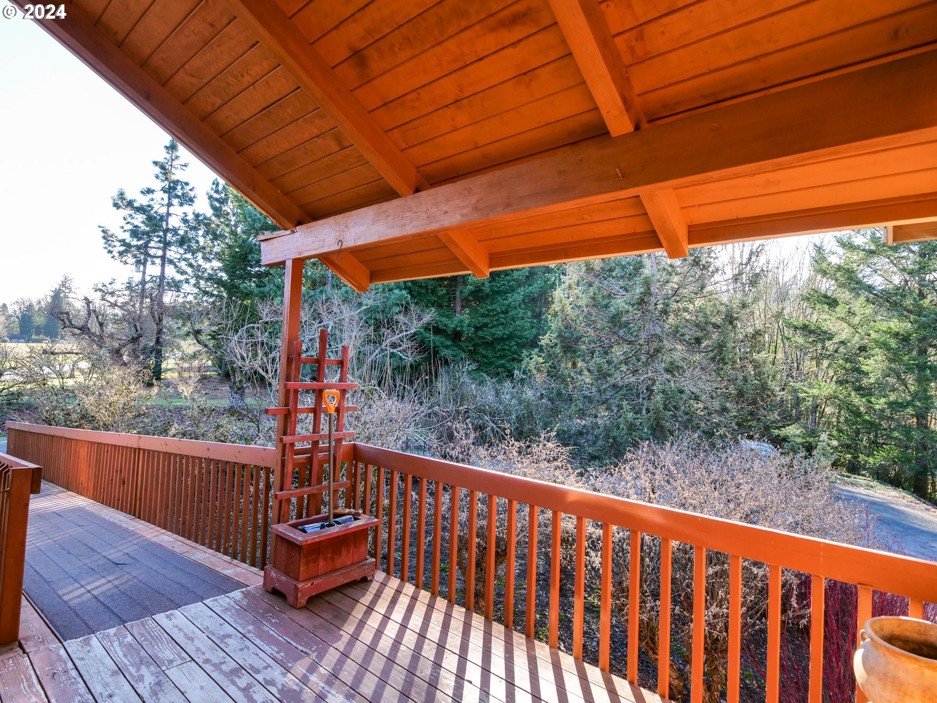 19107 Northwest Logie Trail Road Portland, OR 97231 - Photo 2 of 46 a balcony with wooden floor in outdoor space
