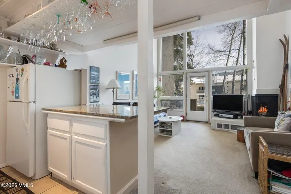 a kitchen with stainless steel appliances a refrigerator and cabinets