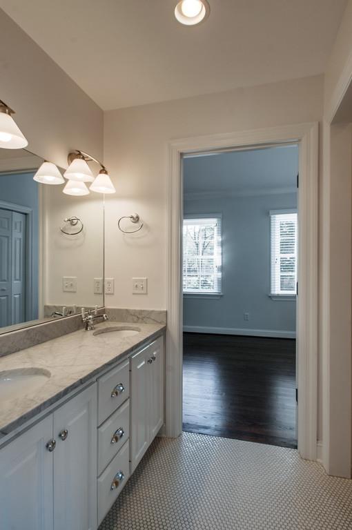 308 Page Road Nashville, TN 37205 - Photo 17 of 22 A jack n jill bathroom connects the two upstairs secondary bedrooms. Double vanities along with shower/tub combo with privacy door.