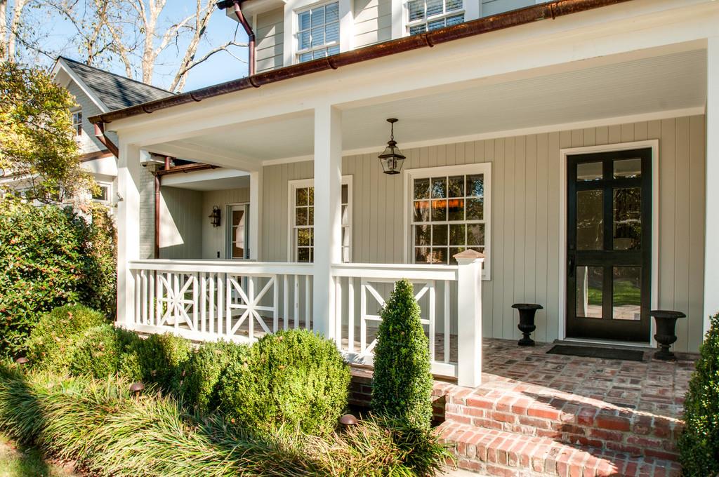 308 Page Road Nashville, TN 37205 - Photo 2 of 22 True cottage like front porch welcomes family, friends and guests making them feel right at home.