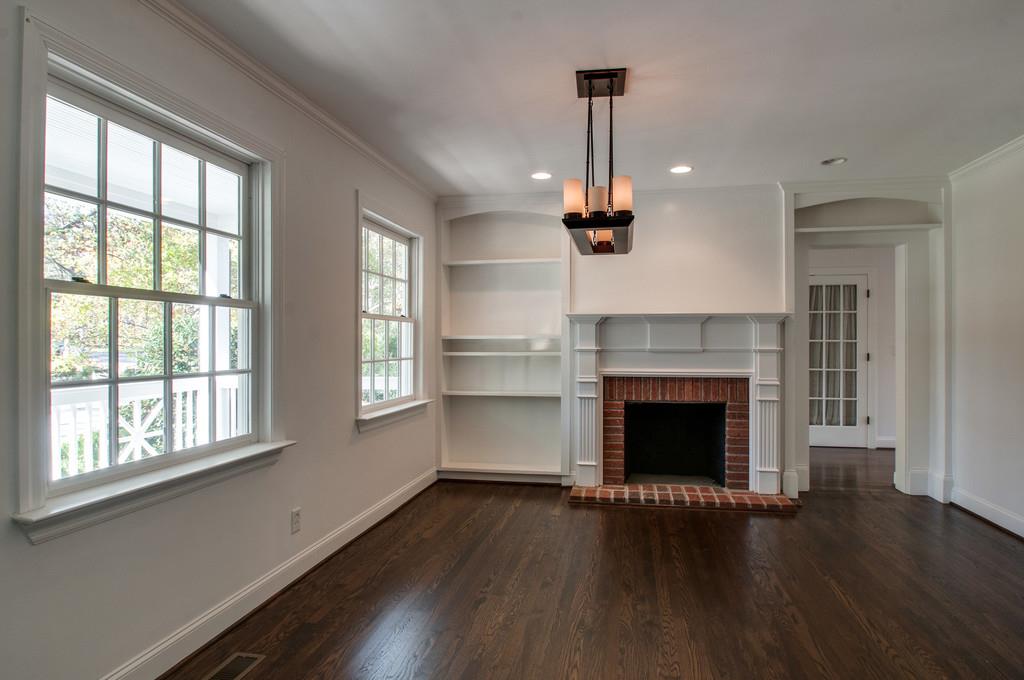 308 Page Road Nashville, TN 37205 - Photo 3 of 22 Just beyond the front door you’re invited into the formal living room with an accent gas burner fireplace and bookcase. (Chandelier has been removed and does not convey)