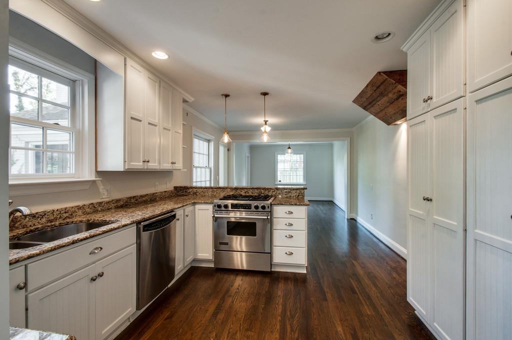 308 Page Road Nashville, TN 37205 - Photo 6 of 22 The heart of the home has maintained a cottage like feel with wainscoting embellished custom cabinets , oversized cupboards for storage and a breakfast bar. 4 burner gas range and stainless steel appliances.