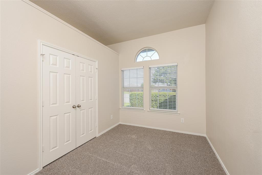 328 Willow Creek Drive Glenn Heights, TX 75154 - Photo 13 of 16 an empty room with windows