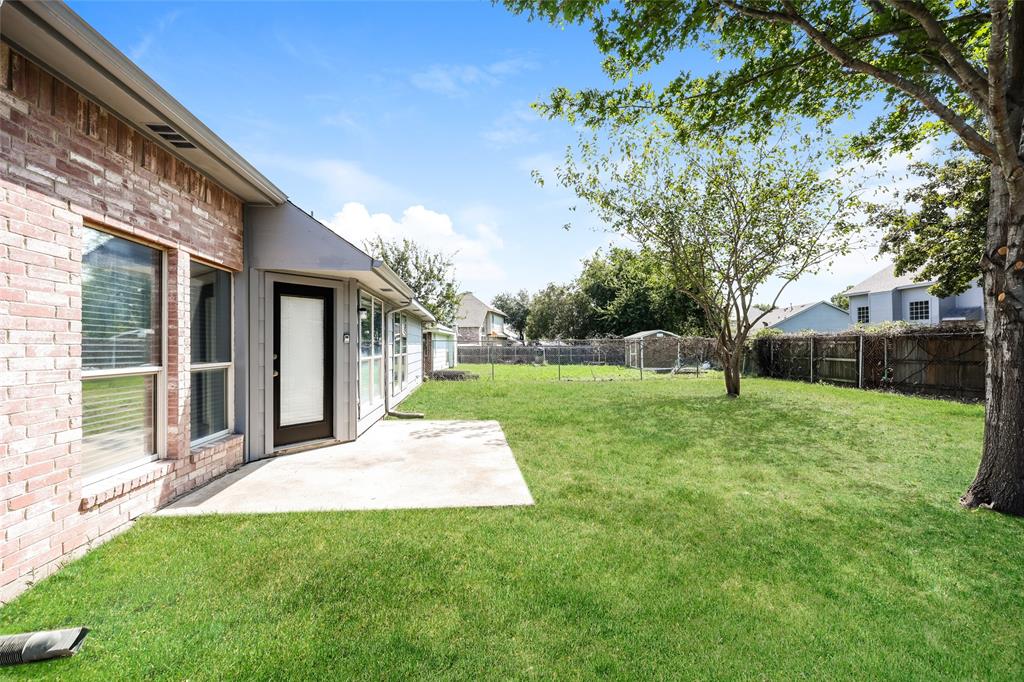 328 Willow Creek Drive Glenn Heights, TX 75154 - Photo 14 of 16 a view of a house with a backyard