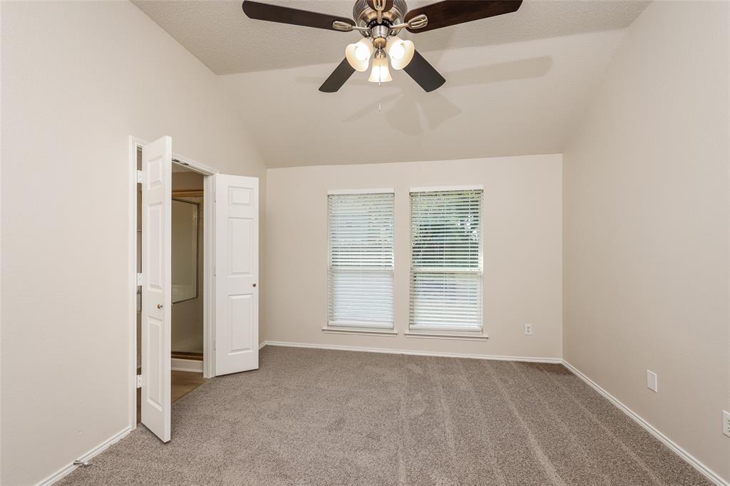 328 Willow Creek Drive Glenn Heights, TX 75154 - Photo 9 of 16 an empty room with closet and a ceiling fan