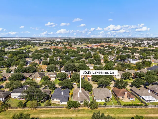 a view of an ocean yard and mountain view in back