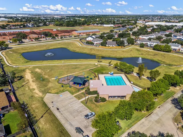 an aerial view of residential houses with outdoor space