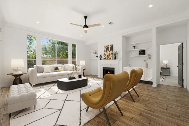 a living room with furniture and a fireplace