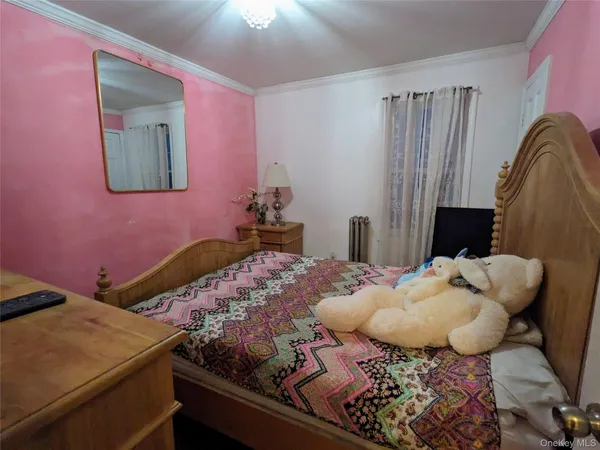 a bedroom with bed and a dresser