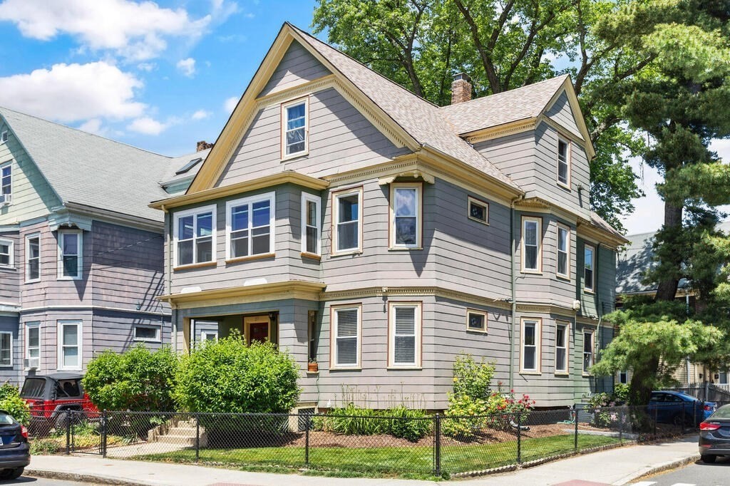 25 Morrison Avenue, Unit 25 Somerville, MA 02144 - Photo 1 of 27 a front view of a house with a yard
