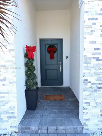 a view of a room with a potted plant