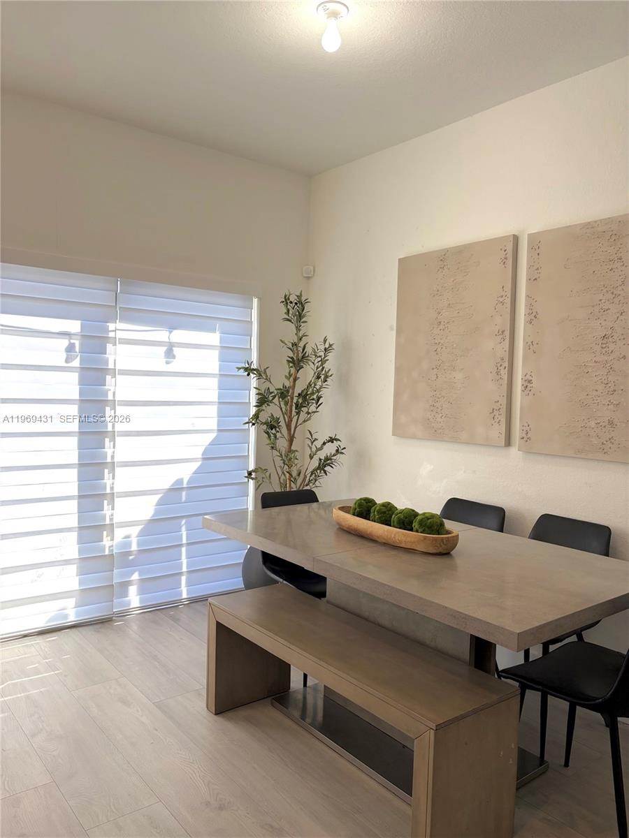 14724 Southwest 181st Terrace Miami, FL 33187 - Photo 24 of 36 a dining room with furniture and window