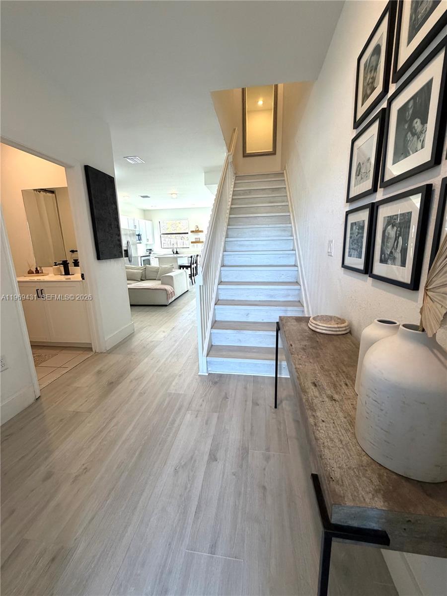 14724 Southwest 181st Terrace Miami, FL 33187 - Photo 27 of 36 a living room with furniture and a flat screen tv